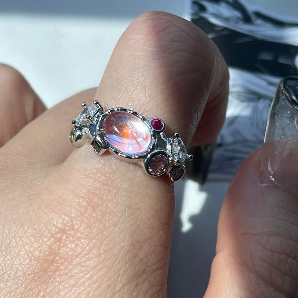 Multicolored ring featuring multiple zircons inlays